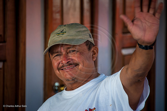 Boatman waving goodbye, San Miguel de Cozumel, Quintana Roo